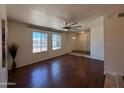 Bright living room featuring hardwood floors, neutral walls and an abundance of natural light at 3145 W Acoma Dr, Phoenix, AZ 85053