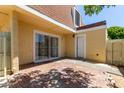 Enjoy this private backyard with red brick flooring at 3350 W Las Palmaritas Dr, Phoenix, AZ 85051