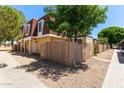 Two-story townhome featuring a secure fence that enhances the privacy and charm at 3350 W Las Palmaritas Dr, Phoenix, AZ 85051