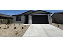 A charming home featuring low maintenance landscaping, a two car garage, and neutral tones at 4328 E Brook Lynn Pl, San Tan Valley, AZ 85143