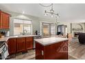 Well-equipped kitchen with stainless steel appliances and an island for meal preparation at 4514 E Verbena Dr, Phoenix, AZ 85044