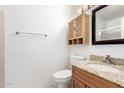 Bright bathroom features a wooden vanity with granite countertop and cabinet at 4901 E Kelton Ln # 1251, Scottsdale, AZ 85254