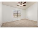 Cozy bedroom features neutral carpet, vaulted ceiling, and a window at 4901 E Kelton Ln # 1251, Scottsdale, AZ 85254