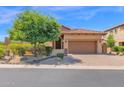 Exterior elevation of a home with a well-kept yard and desert landscaping at 7261 E Norland St, Mesa, AZ 85207