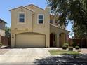 Charming two-story home with a stucco exterior, attached garage, and inviting curb appeal at 7321 S 48Th Dr, Laveen, AZ 85339