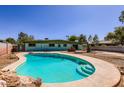 Inviting backyard showcasing a refreshing pool and concrete patio, perfect for relaxation at 736 E Loyola Dr, Tempe, AZ 85282