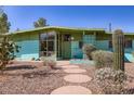 Attractive home featuring desert landscaping, a stone walkway, and an inviting entrance at 736 E Loyola Dr, Tempe, AZ 85282
