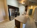 Spacious kitchen featuring stainless steel appliances, granite countertops, and ample cabinet space at 10136 E Southern Ave # 3109, Mesa, AZ 85209