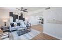 Bright and airy living room with stylish decor, hardwood floors, and access to the dining area at 1061 E Fremont Dr, Tempe, AZ 85282