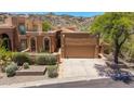 Charming home with well-manicured landscaping, mature trees, and a two-car garage at 11238 N 11Th St, Phoenix, AZ 85020