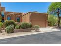 Exterior view of home with landscaped yard, two-car garage, and beautiful desert backdrop at 11238 N 11Th St, Phoenix, AZ 85020