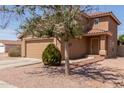 Lovely two-story home with terracotta roof, attached garage, and low-maintenance desert landscaping at 12228 N 122Nd Dr, El Mirage, AZ 85335