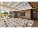 Relaxing covered patio with a modern shade structure, offering an inviting outdoor living space at 1502 E Minton Dr, Tempe, AZ 85282