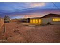 Spacious backyard features low maintenance desert landscaping, with ample room for a pool or recreation at 211 N 7Th St, Avondale, AZ 85323