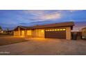 Charming single story brick home boasting meticulously maintained desert landscaping and a two car garage at 211 N 7Th St, Avondale, AZ 85323