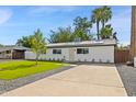 Charming home featuring a manicured lawn, walkway, freshly painted exterior, and well-maintained landscaping at 2201 N 29Th Pl, Phoenix, AZ 85008