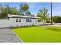 Charming home featuring a manicured lawn, walkway, freshly painted exterior, and well-maintained landscaping at 2201 N 29Th Pl, Phoenix, AZ 85008
