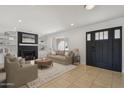 Inviting living room with a fireplace, built-in shelves, and neutral-toned furniture at 2519 E Geneva Dr, Tempe, AZ 85282