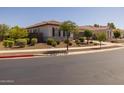 Beautiful home exterior with lush landscaping and a well-maintained lawn on a corner lot at 2750 W Pollack St, Phoenix, AZ 85041