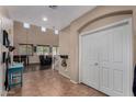 Bright foyer featuring high ceilings, neutral tones, tile flooring, and staircase to the second floor at 3080 E Andre Ave, Gilbert, AZ 85298