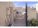 Gated front entrance features well-maintained desert landscaping at 3345 E University Dr # 2, Mesa, AZ 85213