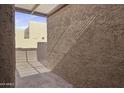 Private exterior patio features a concrete surface and stucco walls at 3345 E University Dr # 2, Mesa, AZ 85213