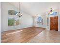 Bright and airy living room with high ceilings, clerestory windows, and a warm and inviting atmosphere at 3550 E Topeka Dr, Phoenix, AZ 85050