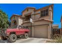 Two-story home with arched entry and basketball hoop over garage at 3625 W South Butte Rd, San Tan Valley, AZ 85144
