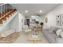 Bright living room featuring an open floor plan and staircase at 4601 N 102Nd Ave # 1020, Phoenix, AZ 85037