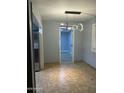 The dining room has a modern light fixture, neutral paint, and tile flooring at 6216 S 5Th Ave, Phoenix, AZ 85041