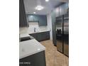 This renovated kitchen features modern cabinetry, sleek countertops, and stainless steel appliances at 6216 S 5Th Ave, Phoenix, AZ 85041