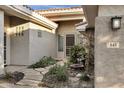 Inviting front entrance featuring a charming courtyard and a decorative fountain with mature landscaping at 645 W Longhorn Dr, Chandler, AZ 85286
