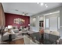 Open-concept living and dining area with a sleek marble table and plush seating at 645 W Longhorn Dr, Chandler, AZ 85286