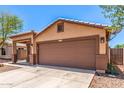 Charming one-story home with desert landscaping, covered porch, and a spacious two-car garage at 7419 W Raymond St, Phoenix, AZ 85043