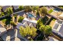 Expansive property featuring a private backyard oasis, pool, and mature trees from an aerial view at 780 W Morelos Ct, Chandler, AZ 85225