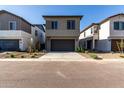 New construction home featuring a two car garage, low maintenance landscaping and a long drive way at 9366 E Sequence Ave, Mesa, AZ 85212