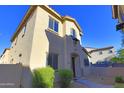 Well-maintained exterior view showcasing the home's architecture, desert landscaping, and private walled yard at 14861 W Ashland Ave, Goodyear, AZ 85395