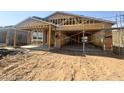 Exterior view of a new home under construction, highlighting wood framing and the structure at 15752 W Camden Ave, Waddell, AZ 85355