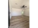 Bright living room featuring new plank flooring and white walls, ready for personalized touches at 1627 W Pueblo Ave, Mesa, AZ 85202