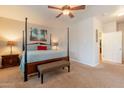 Primary bedroom featuring a four-poster bed, neutral tones, and ample natural light at 16781 W Northampton Rd, Surprise, AZ 85374