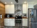 Modern kitchen featuring stainless steel appliances, white cabinetry, and sleek countertops for a clean design at 1725 N Date -- # 8, Mesa, AZ 85201