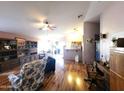 Spacious living room with wood floors and an open layout, seamlessly connecting to other areas at 17257 W Papago St, Goodyear, AZ 85338