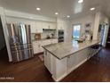 Bright and open kitchen featuring a large island, stainless appliances, and ample cabinet space at 1742 W Butler Dr, Phoenix, AZ 85021