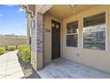 Inviting entryway with brick accents, stylish lighting, and well-maintained landscaping provide a warm welcome at 17850 N 68Th St # 1017, Phoenix, AZ 85054