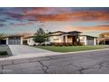Beautiful modern home featuring unique architectural details, wood accents, and a stylish three-car garage at 2215 N 38Th Way, Phoenix, AZ 85008