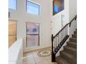 Bright foyer with high ceilings, unique flooring design, and stairwell at 3030 N Saranac --, Mesa, AZ 85207