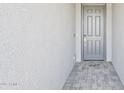 Modern front door with stone tile entryway at 3310 E Valleyhigh Trl, San Tan Valley, AZ 85143