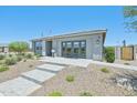 Attractive single-level home with desert landscaping and inviting entrance at 3310 E Valleyhigh Trl, San Tan Valley, AZ 85143