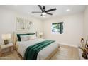 Inviting bedroom with a plush bed, soft lighting from bedside lamps, and an airy feel with natural light at 8341 E Keim Dr, Scottsdale, AZ 85250