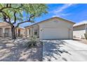 Attractive single-Gathering home featuring a two-car garage and desert landscaping at 9261 W Sheridan St, Phoenix, AZ 85037